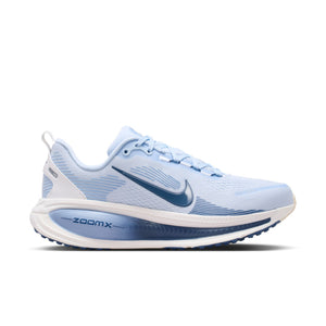 Blue running shoe with white sole on a white background