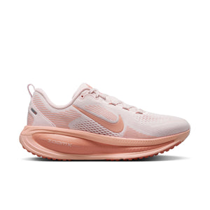 Pink running shoe with a visible brand logo on a white background.