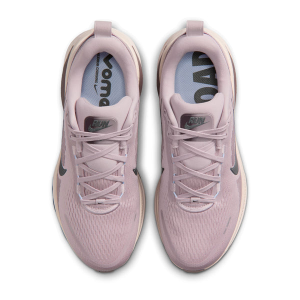 Pair of pink running shoes with visible brand logo on a white background