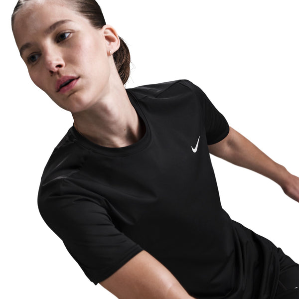 Person wearing a black Nike t-shirt on a white background