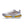 White running shoe with colorful sole on a white background
