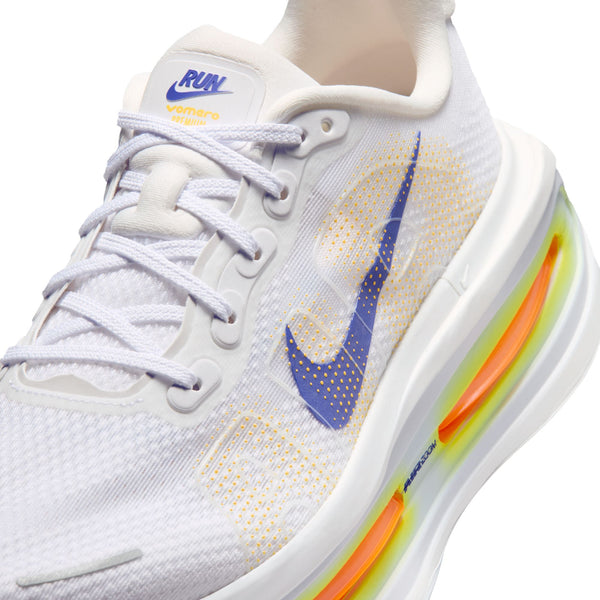 Close up of a Nike Vomero Premium shoe with a white upper and blue swoosh.
