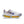 White Nike running shoe with a blue swoosh and large Air Zoom units.