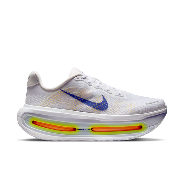 White Nike running shoe with a blue swoosh and large Air Zoom units.
