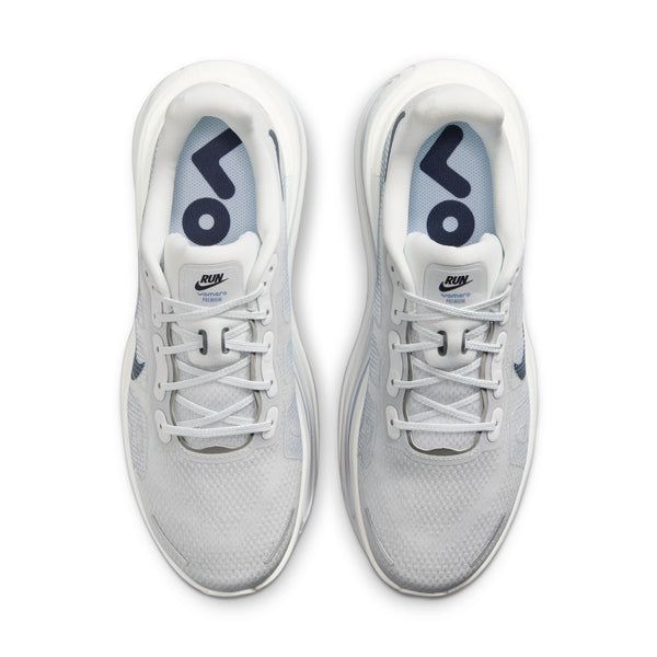 A top down look at a niek running shoe with the name Vomero Premium on a tag at the top of the tongue.