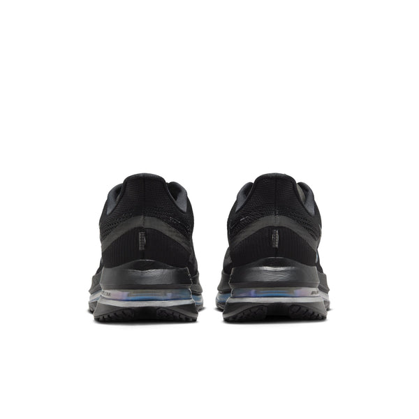 Black athletic shoes with sole design on a white background