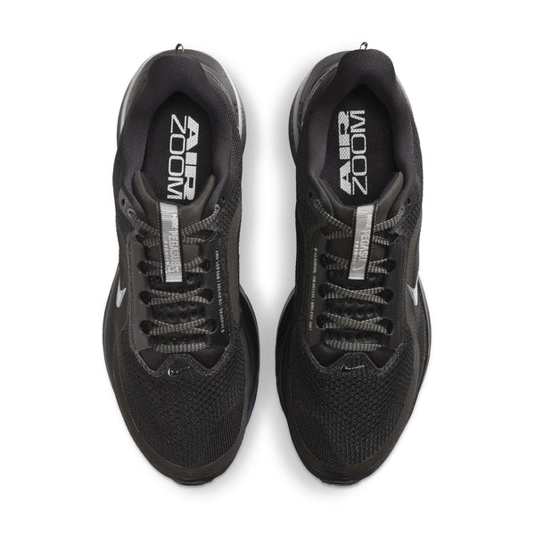 Black running shoes with 'Zoom' branding on a white background
