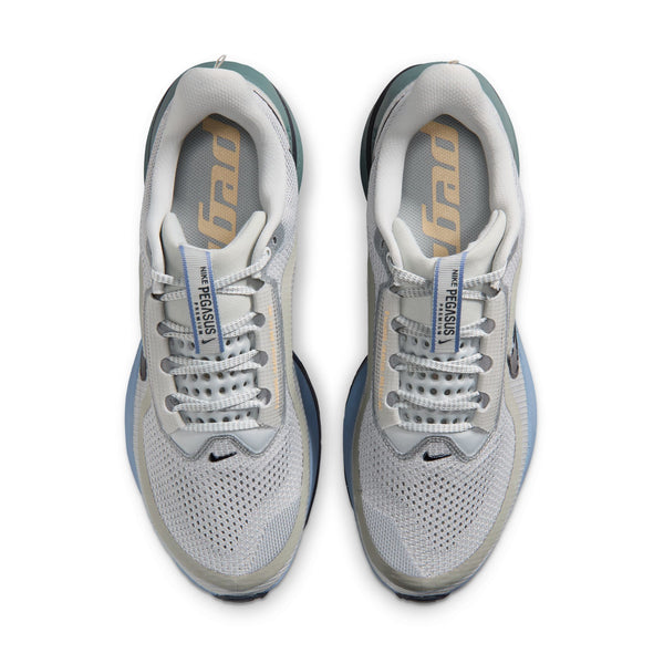 Pair of white running shoes with blue accents on a white background