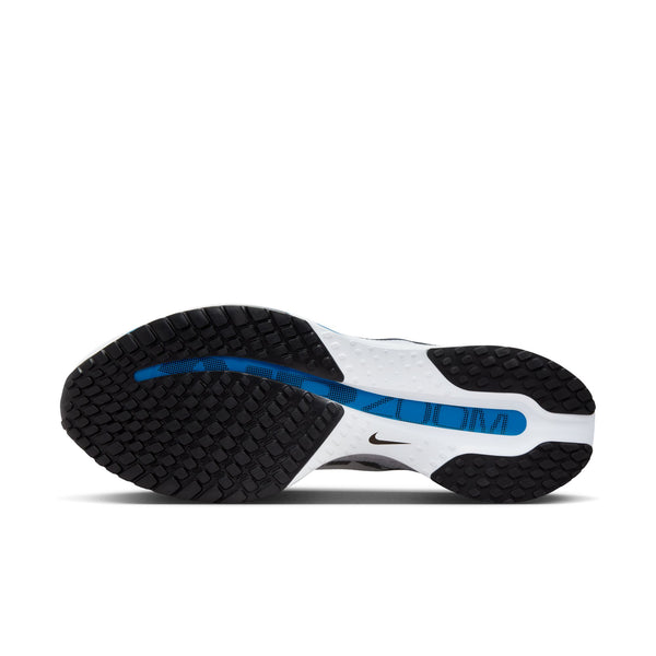 Side view of a black and white sneaker with blue accent on a white background.