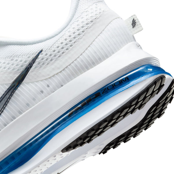Close-up of a white Nike running shoe with blue sole on a white background.