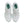White sneakers with green accents on a white background