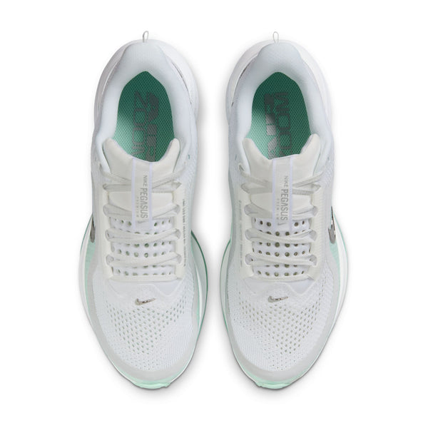White sneakers with green accents on a white background