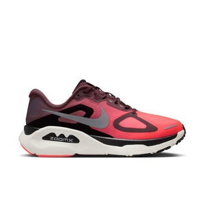 Red and black women's stability running shoe with Nike logo on a white background.