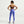 Woman wearing a brown sports bra and blue leggings on a white background
