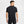Man wearing a black athletic outfit on a white background