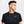Man wearing a black Nike athletic shirt on a light gray background