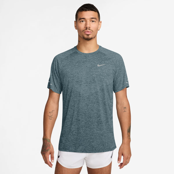 Man wearing a Nike t-shirt and shorts on a white background