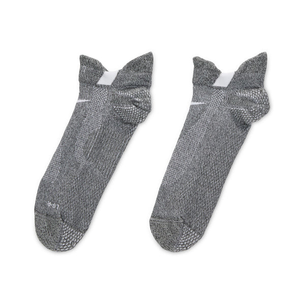Pair of gray socks with textured pattern on a white background