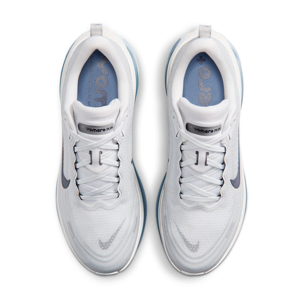 White sneakers with blue accents on a white background