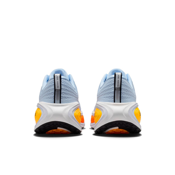 Pair of light blue and white sneakers with orange accents on a white background