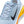 Light blue running shoe with orange sole and black Nike logo on a white background