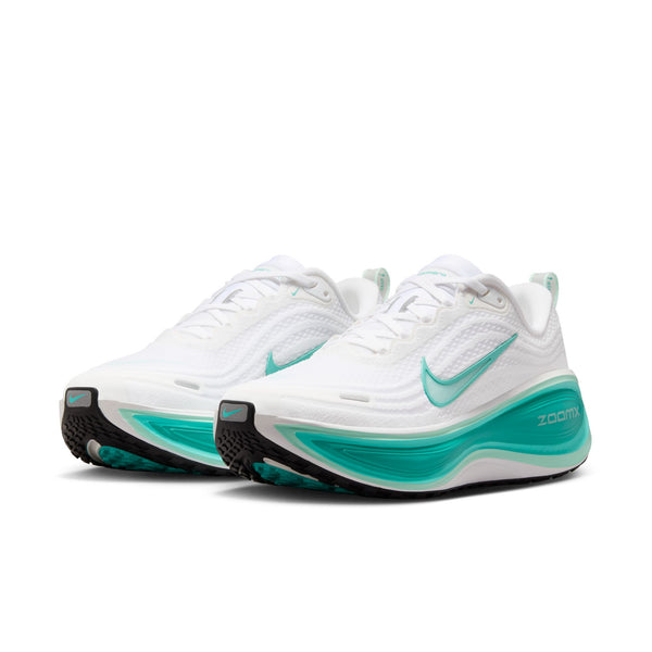 White and teal running shoes with 'Zoom' branding on the midsole.