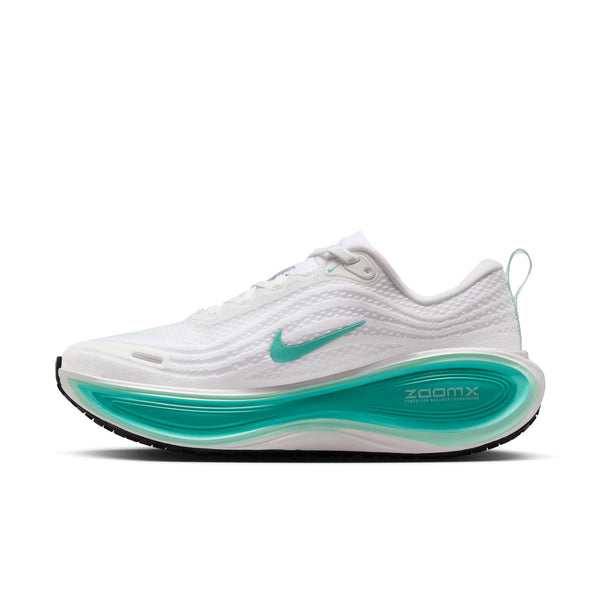 Medial side a white Nike running shoe with teal sole on a white background.