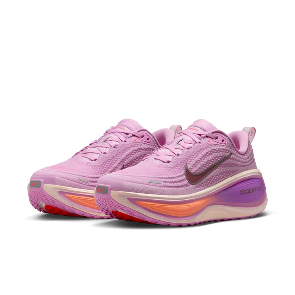 Pink running shoes with visible Nike logo on a white background