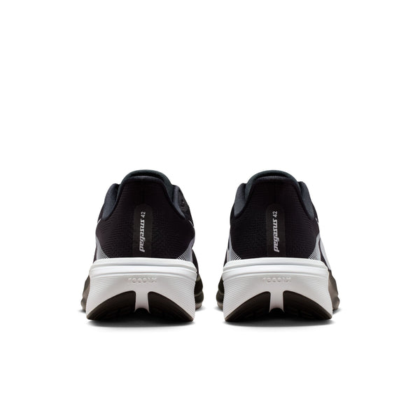Black running shoes with white soles on a white background