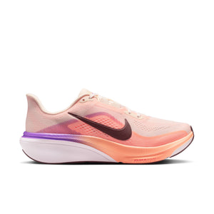 Light pink and orange running shoe with a black swoosh logo on a white background