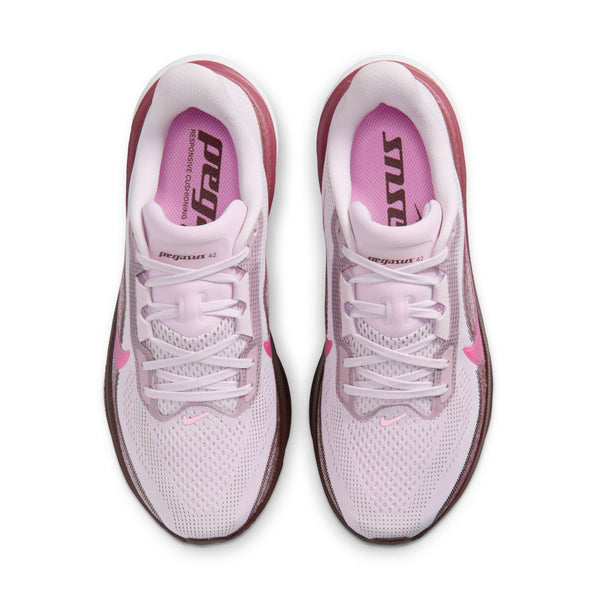 Pink running shoes with visible brand logo on a white background