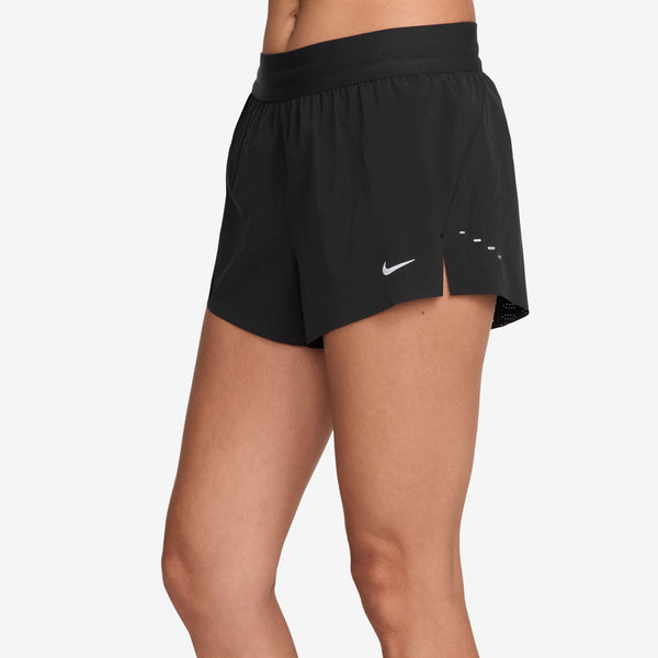 Black athletic shorts with a Nike logo on a white background