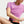 A close-up of a woman wearing a purple Nike athletic short-sleeve shirt and black shorts with a bright orange and black waist pack, against a light gray background.