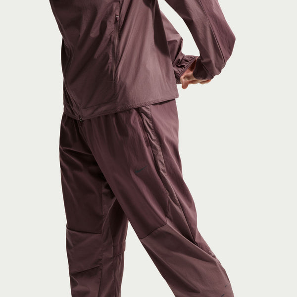 Maroon raincoat and pants on a white background