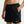 Black Nike shorts worn by a person on a white background