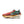 Multicolored running shoe with 'ZoomX' sole on a white background.