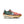 Multicolored sneaker with a unique sole design on a white background.