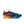 Multicolored running shoe with 'Zoomx' branding on a white background.