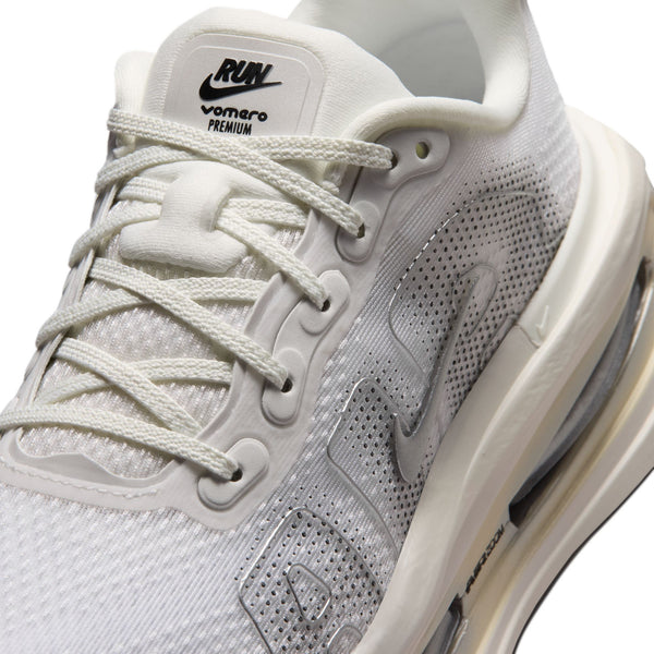 White athletic shoe with lace-up design on a white background