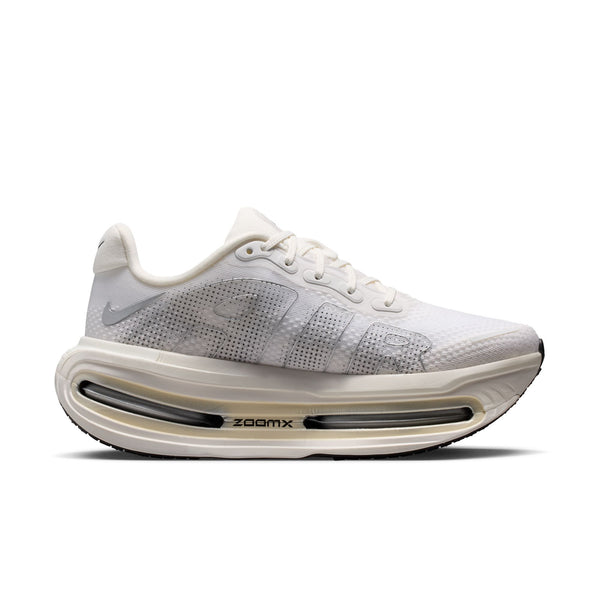 White running shoe with visible 'zoomx' technology on a white background