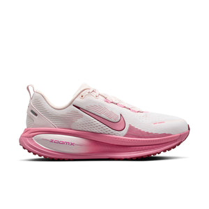 Pink and white running shoe with Nike logo on a white background.