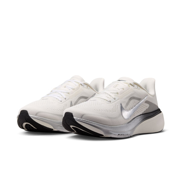White athletic shoes with black soles on a white background
