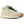 A New Balance sneaker in cream suede and leather with dark green laces, shown from on a white background.
