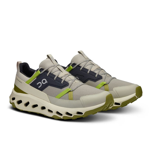 Pair of Mens trail shoes that are gray and green on a white background.