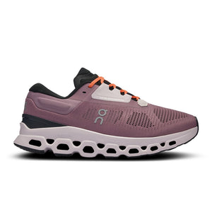 A pair of women's running shoes with pink uppers and black and orange accents, featuring a white logo on the side.