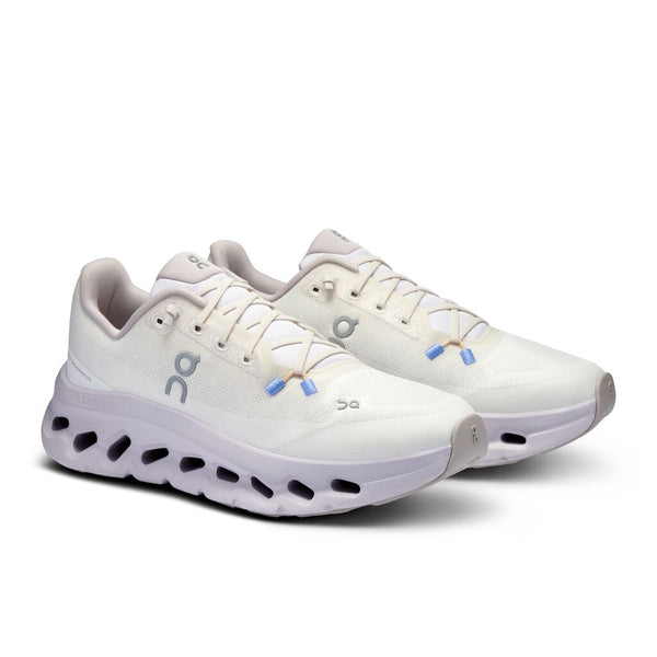White running shoes with blue accents on a white background.