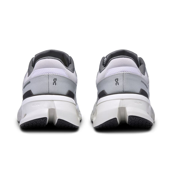 A pair of On running shoes with a close up views of the heel.