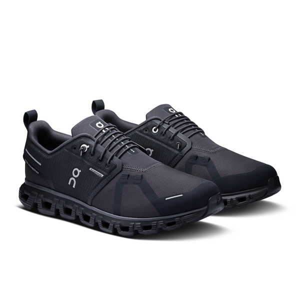 These waterproof On shoes are all black and have a bungee lace.