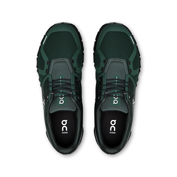 This pair of On shoes are monochromatic with a dark green.