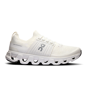 A pair of white athletic shoes with a unique sole design featuring air pockets.